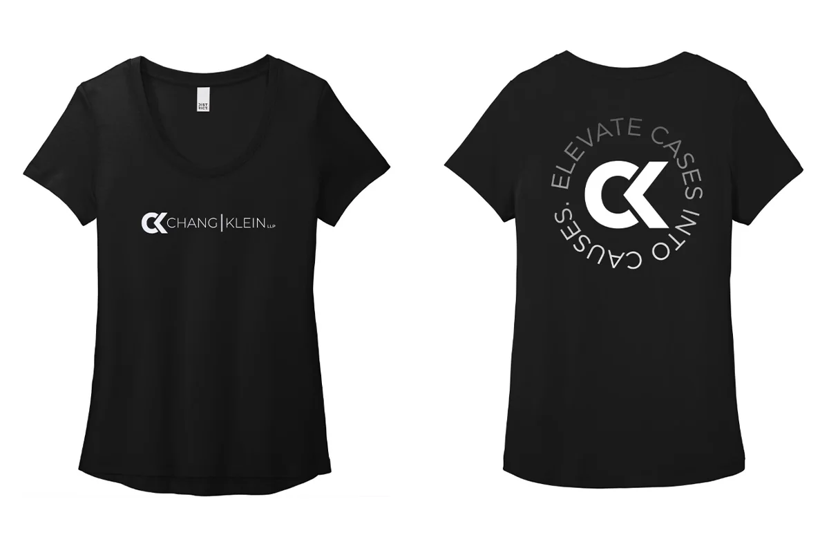 Black tee front with a Chang Klein wordmark and back with a large CK monogram surrounded by the tagline.
