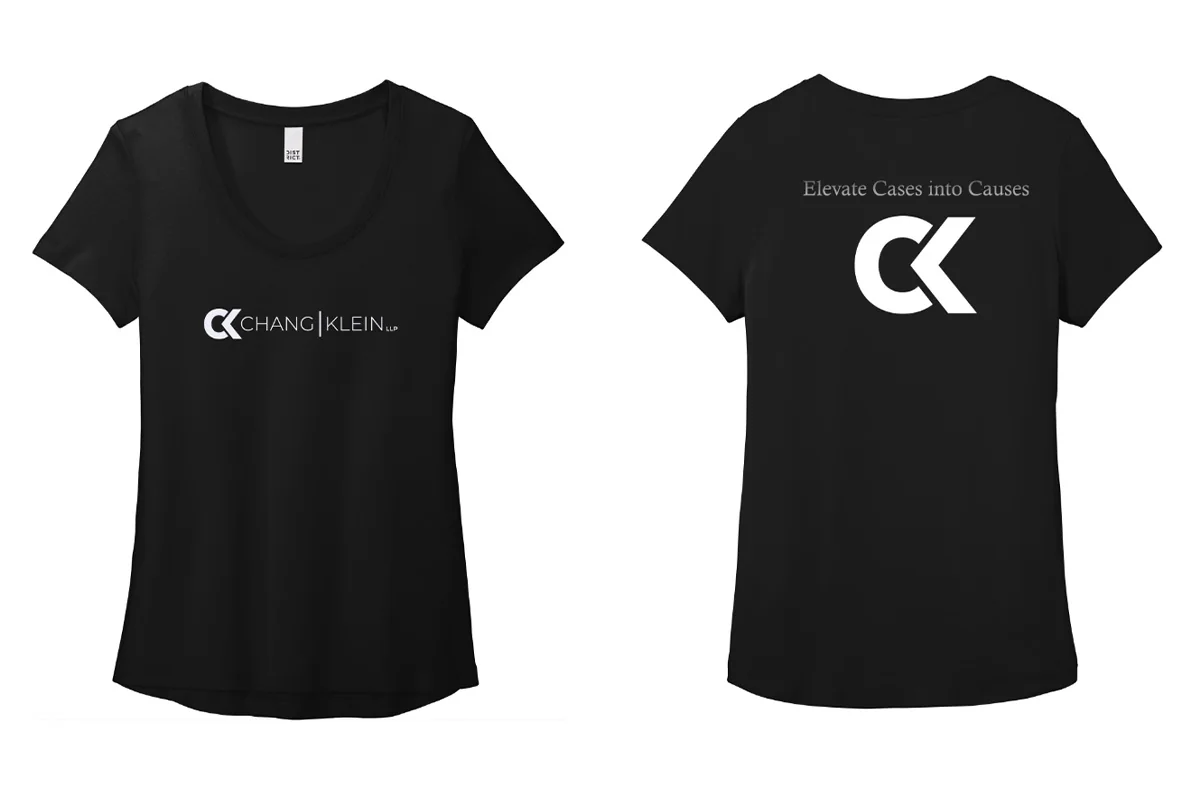 Black tee front with a Chang Klein wordmark and back with a large CK monogram below the tagline.