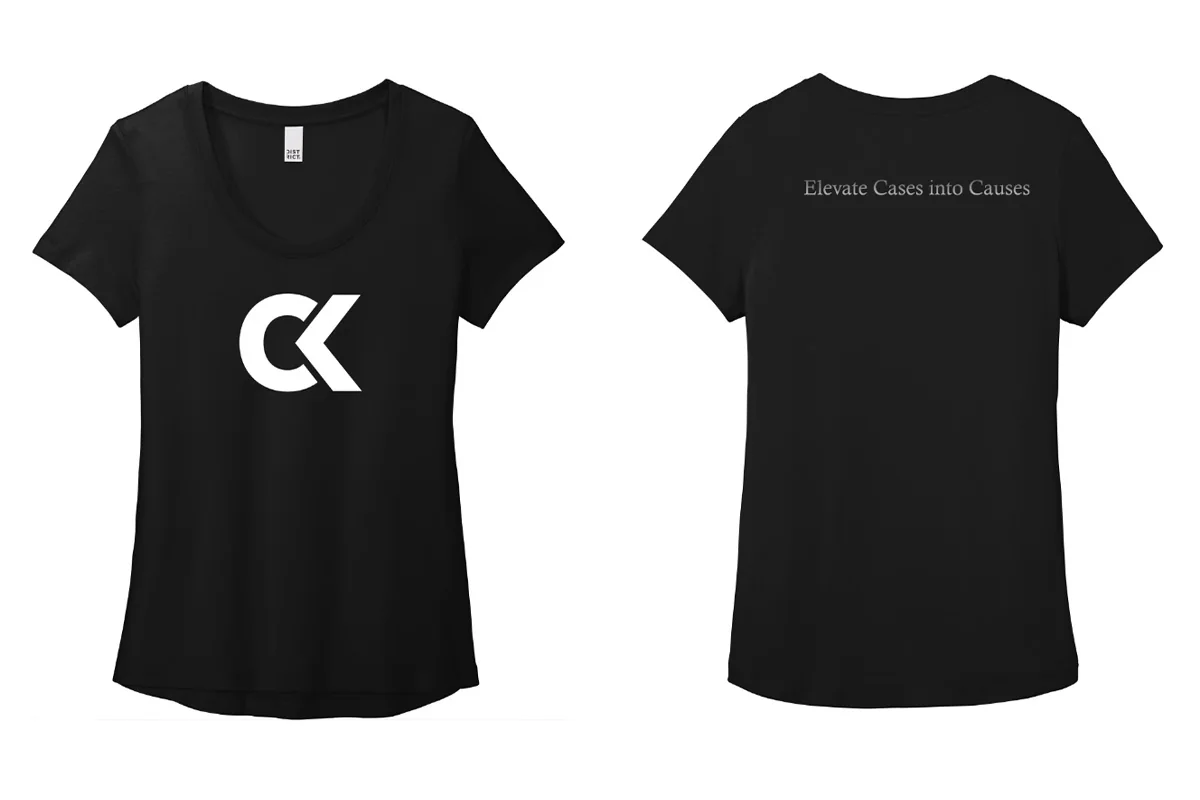 Black tee with a large white CK chest monogram and the tagline across the upper back.