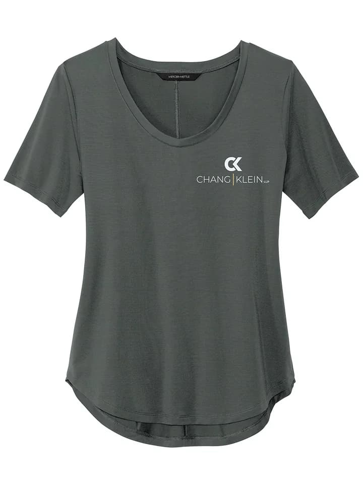 Green curved-hem tee with a stacked white Chang Klein logo on the left chest.